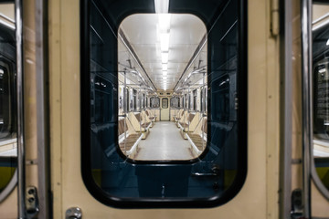 Kyiv metro wagon interior with no people through the window