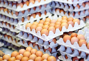 a lot of eggs in the cardboard boxes.