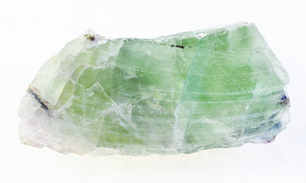 rough green Beryl crystal on white