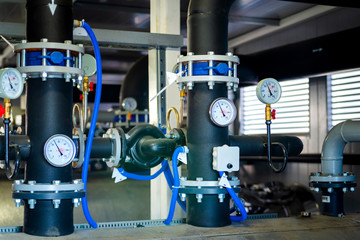 The equipment of the boiler-house, valves, tubes, pressure gauges, thermometer. Close up of...