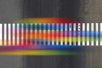 Aerial. Blurred colorful pedestrian traces on a crosswalk. City lifestyle concept.