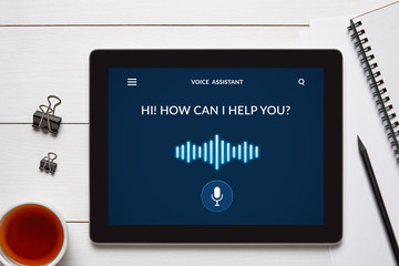 Voice assistant concept on tablet screen with office objects