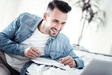 Handsome student completing his test