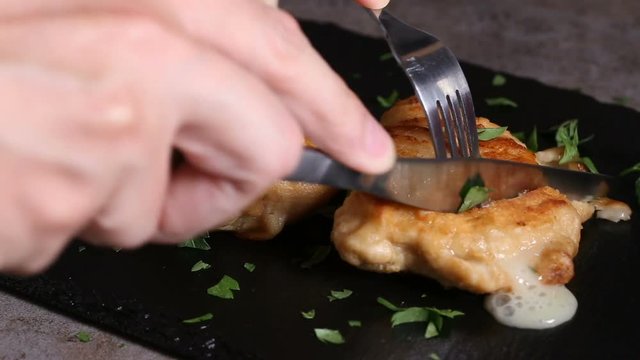 Eating with fork and knife cordon bleu food