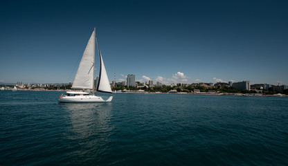 White yacht sailing in the open sea