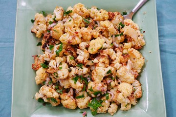 Healthy salad of roasted cauliflower with parsley and onions