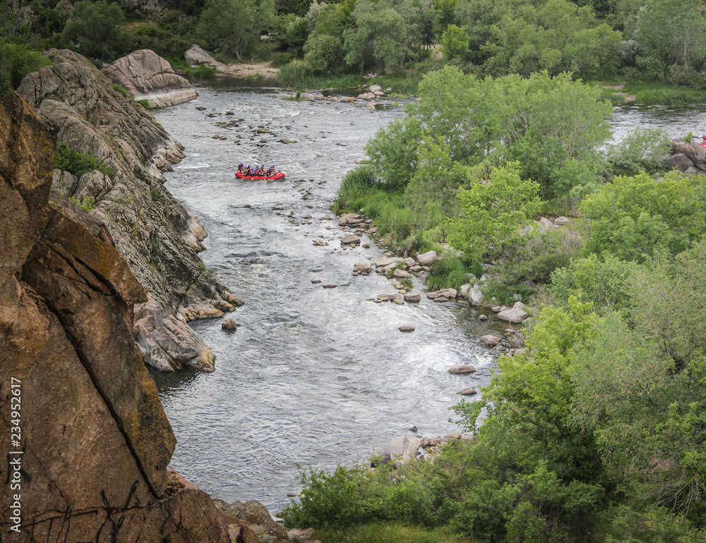 Wall mural top view. group of people with guide whitewater rafting and rowing on river, extreme and fun sport a