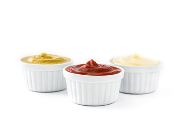 Ketchup,mustard and mayonnaise in a bowls isolated on white background