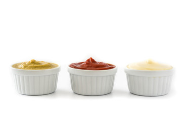 Ketchup,mustard and mayonnaise in a bowls isolated on white background