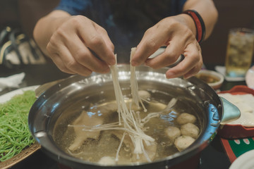  Sport women eats suki yaki after exercise