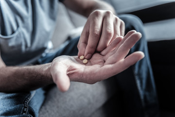 Focused photo on medicine that being in male palms