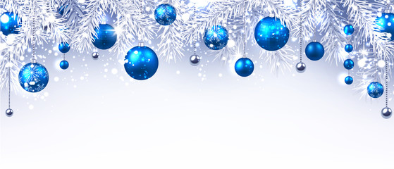 Christmas and New Year banner with fir branches and blue Christmas balls.