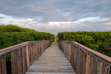 Fototapeta premium wooden bridge at pompano beach with beach access