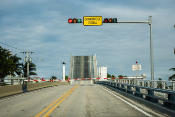 open draw bridge with red light at pompano beach