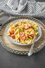 Salmon with pasta and tomatoes