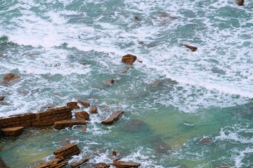 the rocks in the sea in the coast