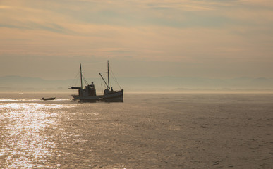 Fishing boat in sunrise light