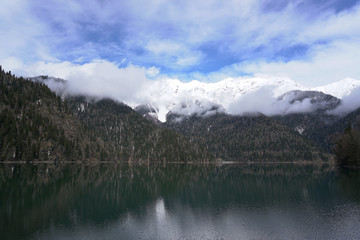 Fototapeta na wymiar landscape sky snow mountains and mountain Lake