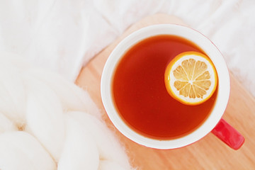 Having a cup of tea in bed - cozy breakfest at home