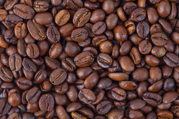 Roasted brown coffee beans pattern, background, top view