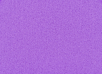 Purple sponge texture background, close up view of a cosmetic sponge or pad for facial make up