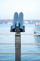 binoculars on the city promenade 