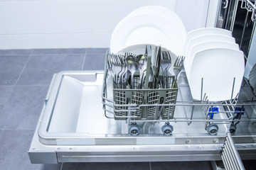 dishwasher open with clean dishes
