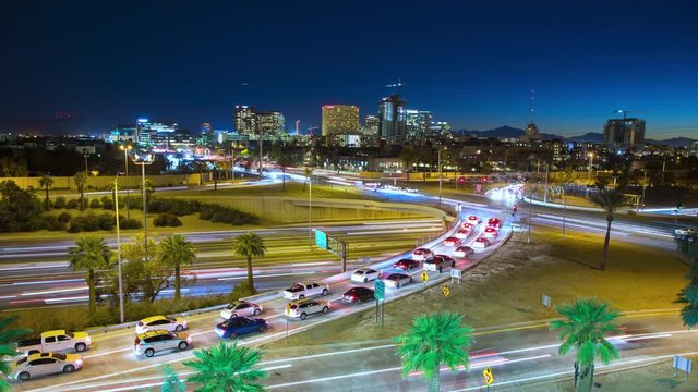 Phoenix AZ Night Cityscape Generic Traffic Timelapse with Streaking Lights from Cars Driving during Rush Hour under a Clear Blue Arizona Evening Sky