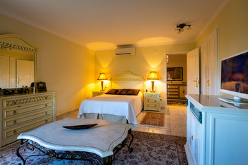 The dining room in classical style, light furniture, marble, luxury.