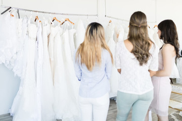 Best Buddies Selecting Bridal Gown In Store