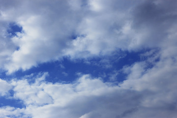 Naklejka na ściany i meble Idyllic white clouds on blue sky