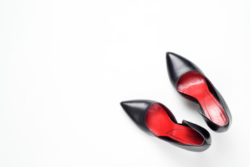 Black woman shoes on white background. Flat lay, top view trendy fashion feminine background. Beauty blog concept.