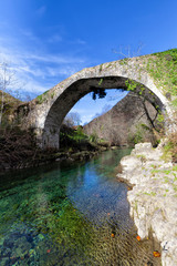 Fototapeta na wymiar Medieval bridge over the Dobra river