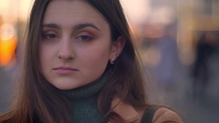 Close-uo look of caucasian women with amazing brown eyes and long dark hair standing calmly and being relaxed and assured in rush of city, urban illustration