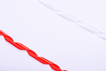 Red and white twirled silk ribbons.