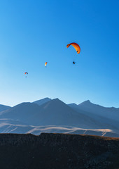 Fototapeta na wymiar Paragliding in mountains