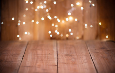 Christmas Bokeh background with empty wooden