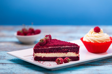 Piece of red velvet cake, homemade cake with raspberry
