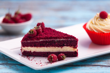 Piece of red velvet cake, homemade cake with raspberry