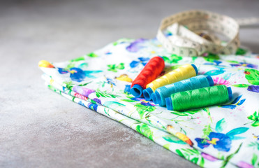 Fototapeta na wymiar A set of colorful coils on a bright colored fabric.