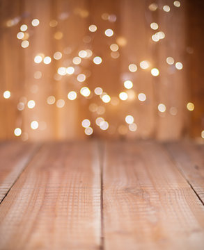 Christmas Bokeh background with empty wooden