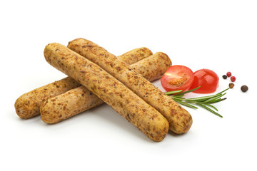 Delicious BBQ Sliced Sausages with herbs and tomatoes, isolated on a white background. Close-up.