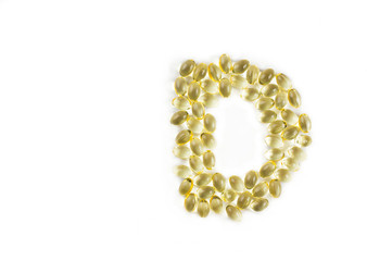 Obraz premium Vitamin D supplements, letter D isolated on white.