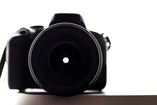 Close up of a professional photography camera on a white background