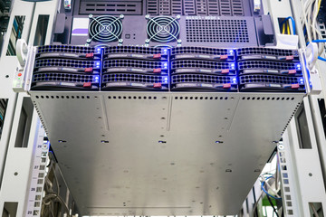 Powerful server equipment is in the rack of the data center. The central computer is  close-up. The...