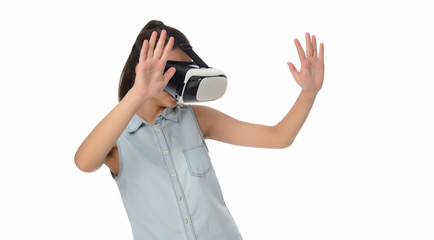 Young woman in virtual reality (VR) glasses holding tablet. Isolated on white background
