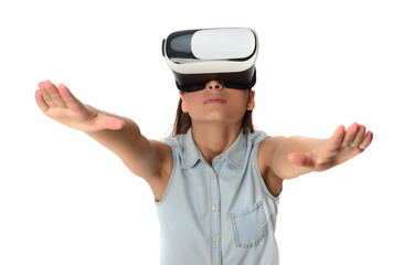  Young woman in virtual reality (VR) glasses holding tablet. Isolated on white background