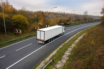 Road transport. Articulated lorry in motion on the road