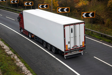 Road transport. Articulated lorry in motion on the road