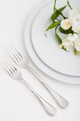 Table Setting with Plate, Forks and Flowers